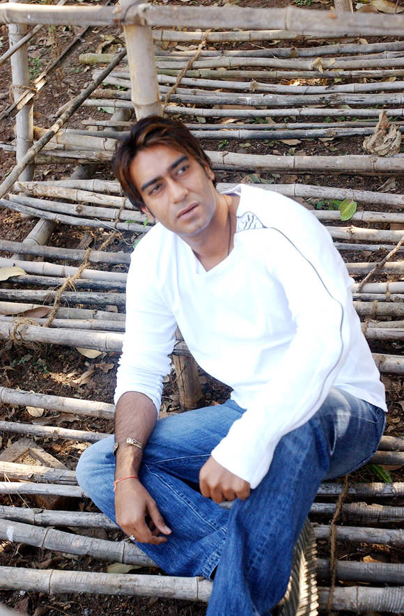 Ajay Devgan In White T-shirt And Blue Jeans