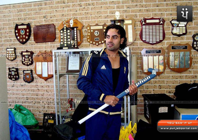 Aman Dhaliwal Holding Hockey