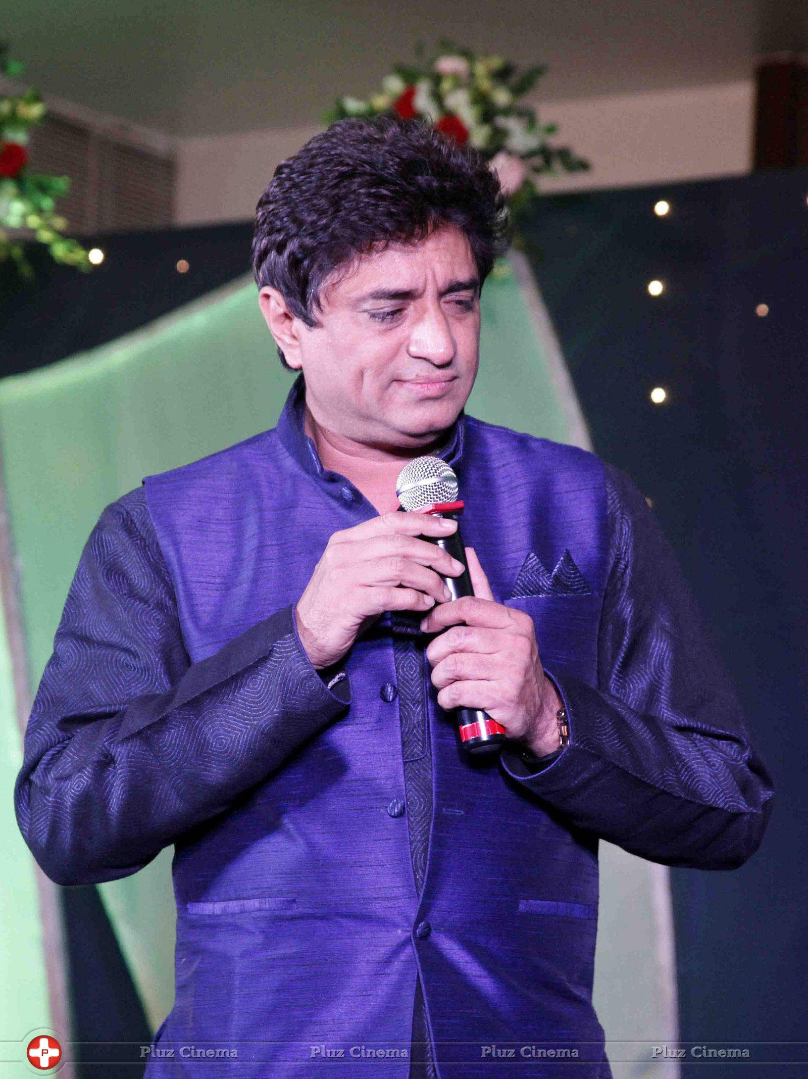 Anand Raj Anand Holding Mic