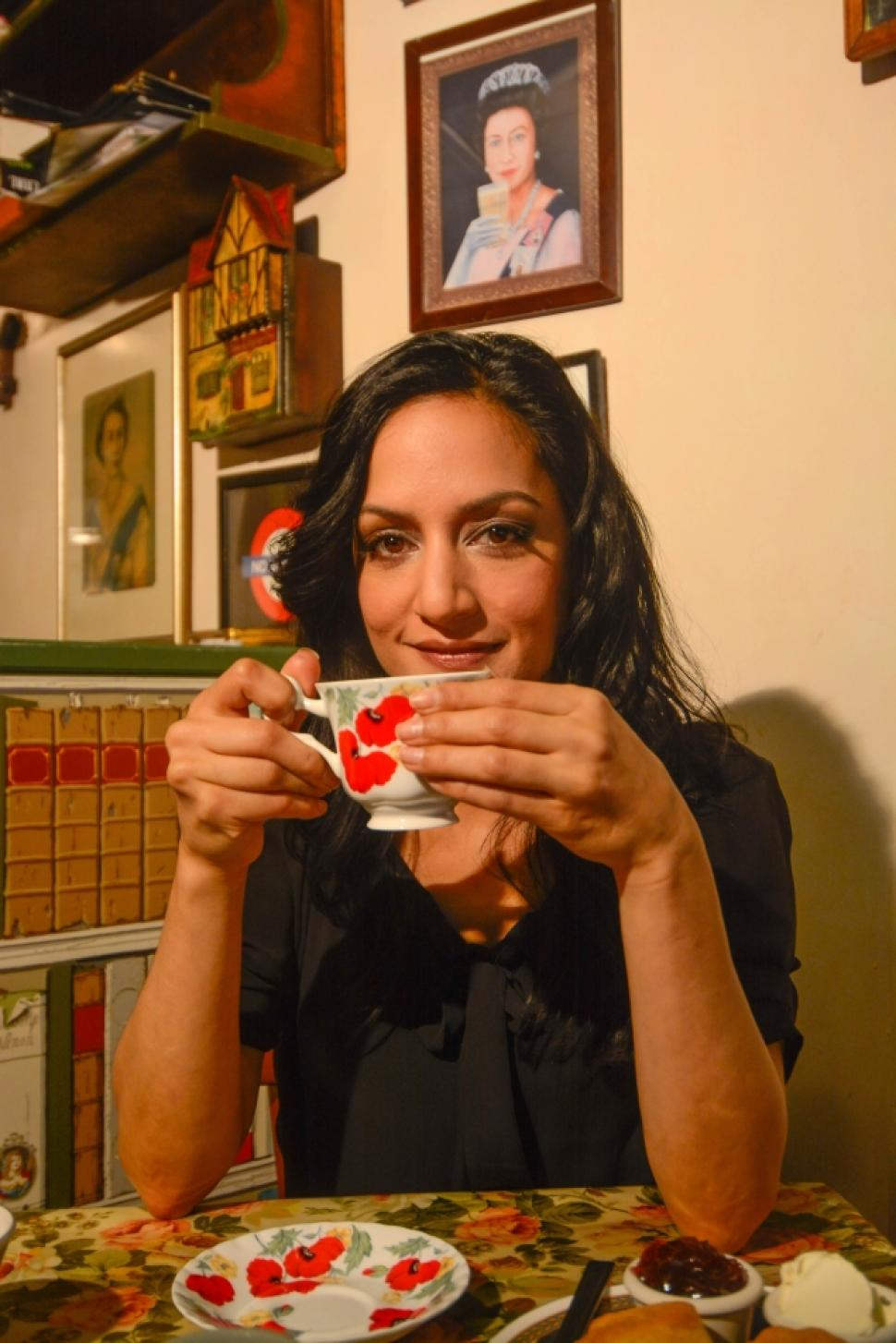 Archie Panjabi Holding Cup