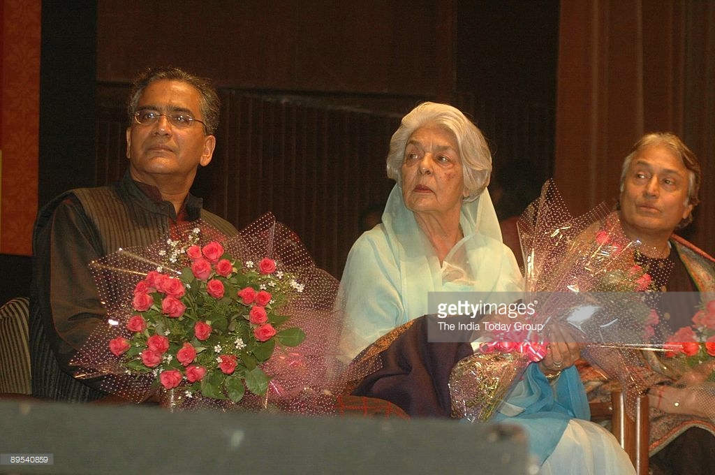 Aroon Purie Holding Flowers