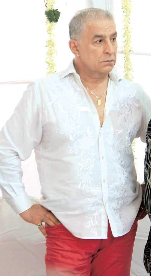 Dalip Tahil Wearing White Shirt