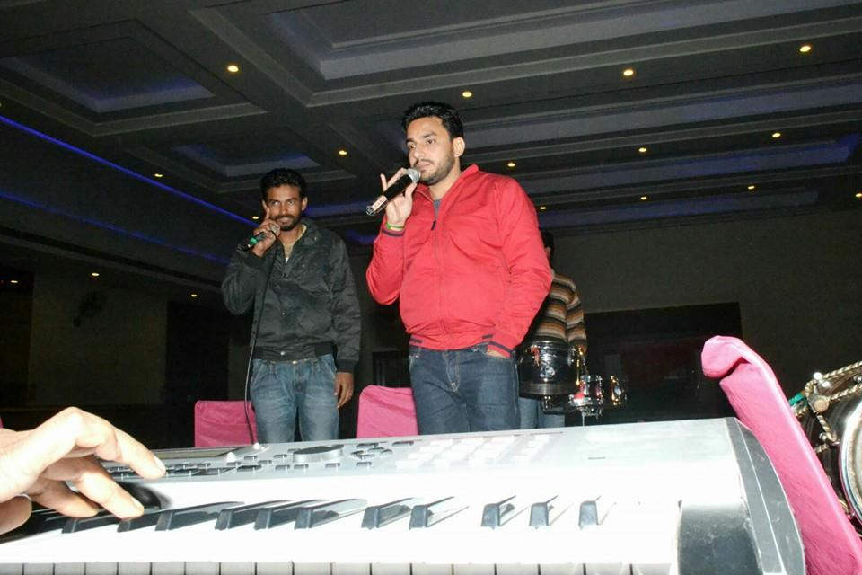 Deep Dhillon Wearing Red Jacket