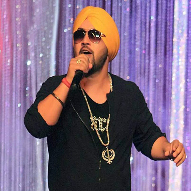 Dilbagh Singh Singing On Stage