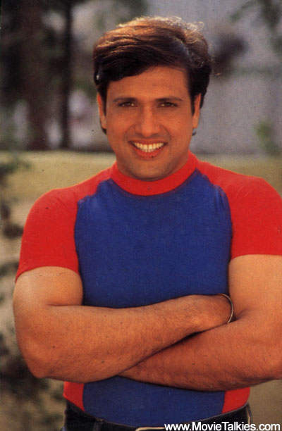 Govinda Wearing Red And Blue Combination T-shirt