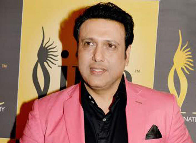 Indian Actor Govinda Wearing Pink Coat