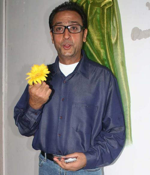 Gulshan Grover Holding Flower