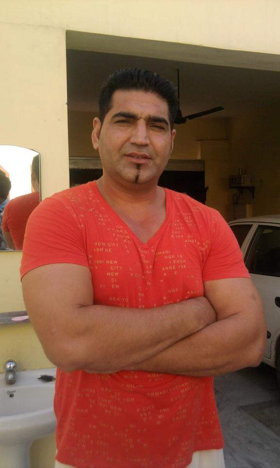 K. S. Makhan In Orange Tshirt