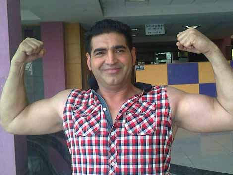 K. S. Makhan Showing His Muscles