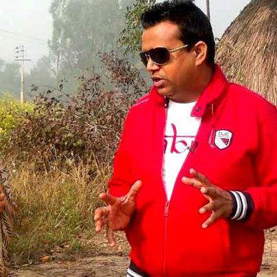 Karamjit Anmol In Red Jecket