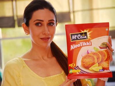 Karisma Kapoor Holding Mccain Aloo Tikki Packet