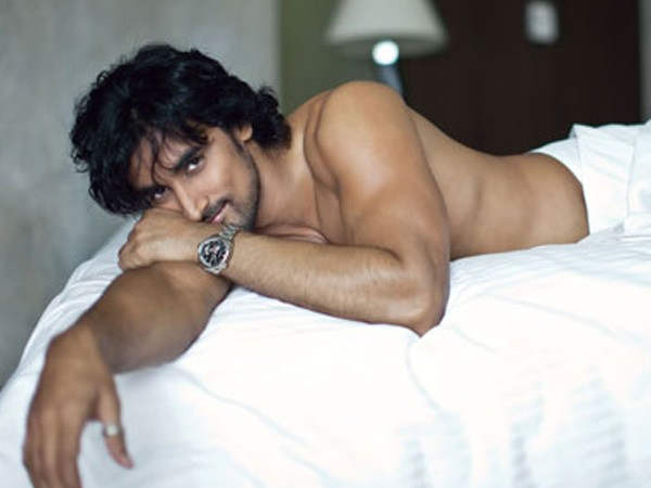 Kunal Kapoor Laying On Bed