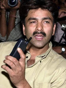Manoj Prabhakar Holding Phone