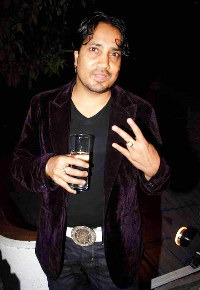 Mika Singh Holding Glass