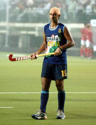 Prabhjot Singh Holding A Hockey Stick