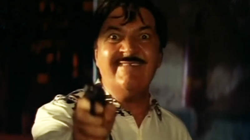 Prem Chopra Holding Gun