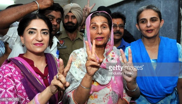 Preneet Kaur And Other Show Victory Sign