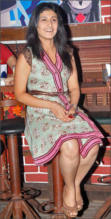 Ragini Khanna Sitting On Table