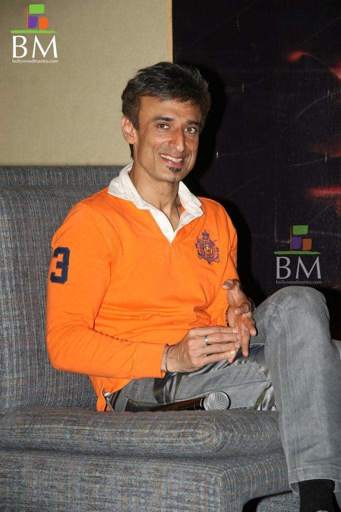 Rahul Dev Sitting On Soffa