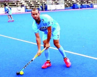 Ramandeep Singh Holding Hockey Stick