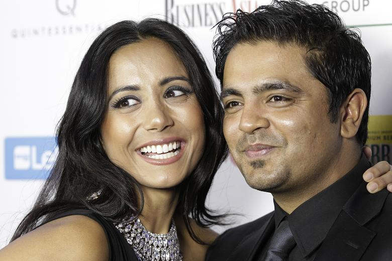 Rishi Rich And His Wife Smiling