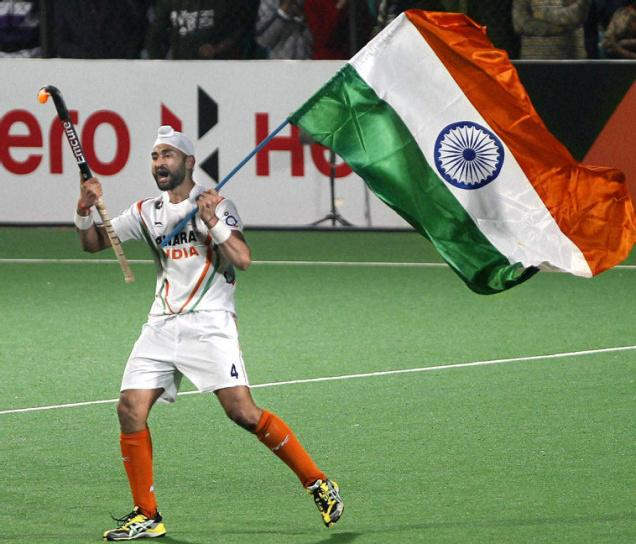 Hockey Player Sandeep Singh Holding Flag