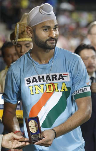 Player Sandeep Singh Holding Award