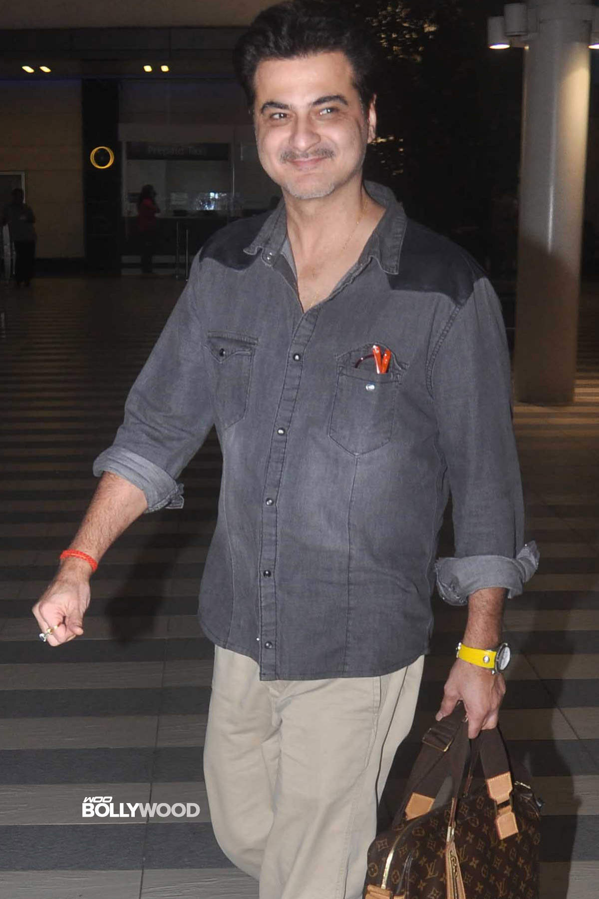 Sanjay Kapoor Holding Bag