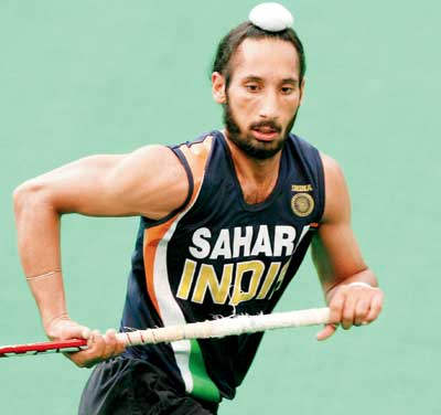 Player Sardara Singh Holding Hockey Stick