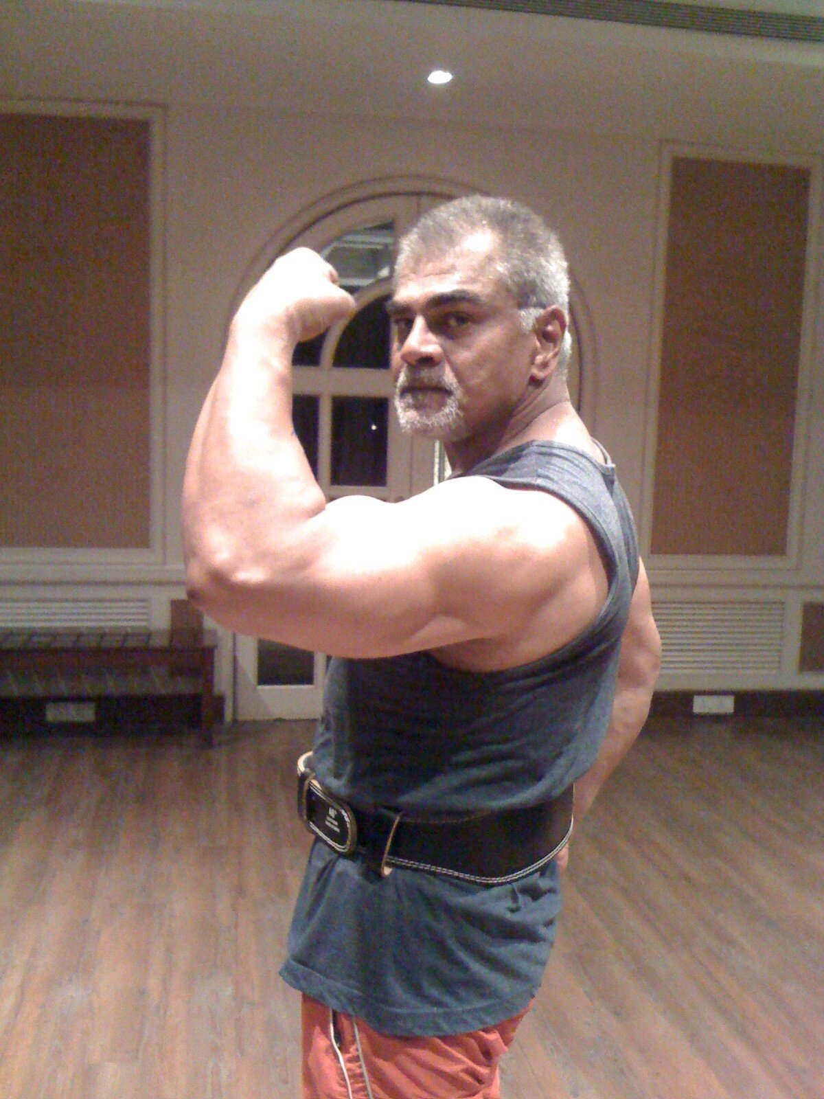 Sharat Saxena Showing His Muscle