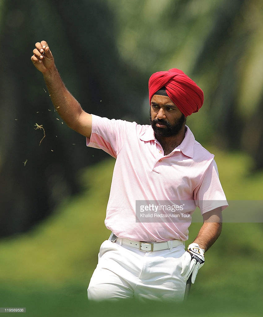 Sujjan Singh Holding Grass