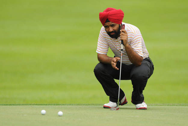 Sujjan Singh Looking At Golf Balls