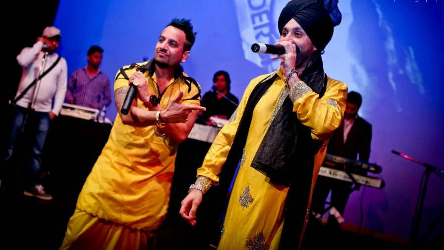 Sukhshinder And Jazzy B Performing On Stage