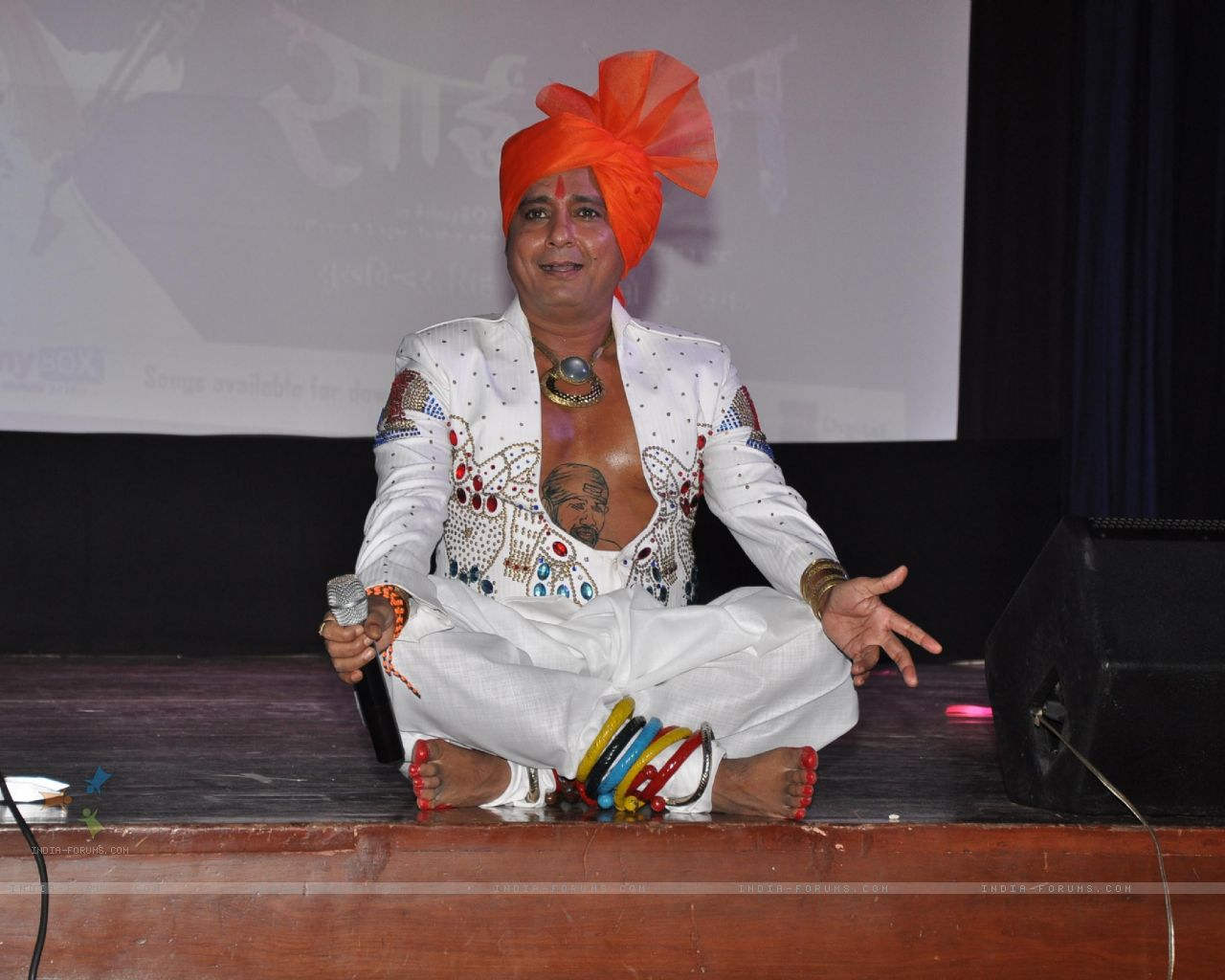 Sukhwinder Singh Sitting On Stage
