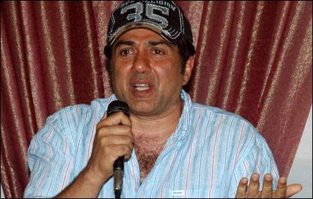 Sunny Deol Holding Mic