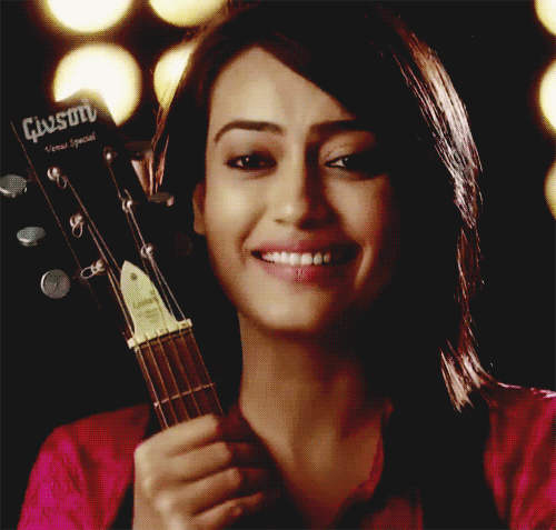 Surbhi Jyoti Holding Guitar