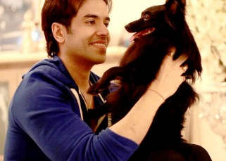 Tusshar Kapoor Playing With His Dog
