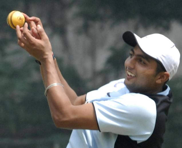 V.R.V Singh Holding Ball
