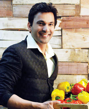 Vikas Khanna Holding Vegetables Tray
