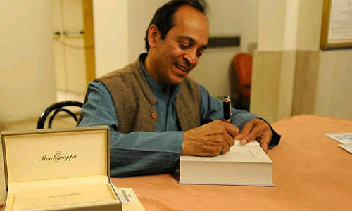 Vikram Seth Writing Something On Book