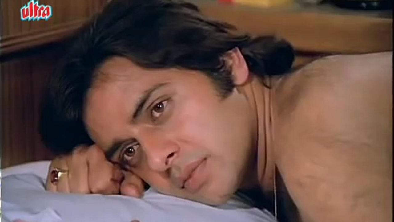 Vinod Mehra Laying On Bed