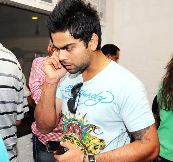 Virat Kohli Holding Phone