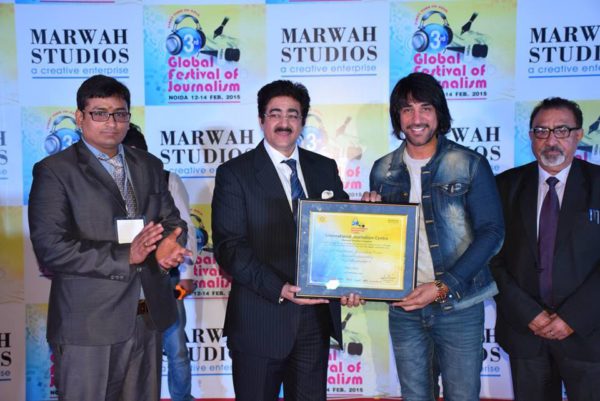 Ashok Mastie Receiving Award