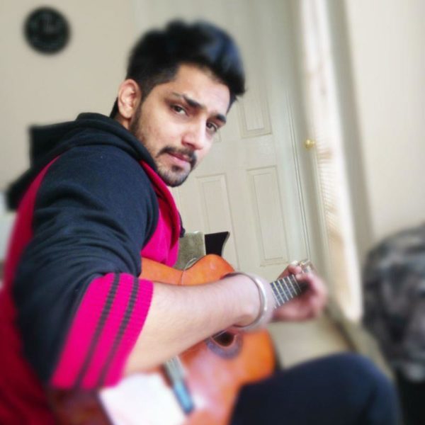Babbal Rai Playing Guitar