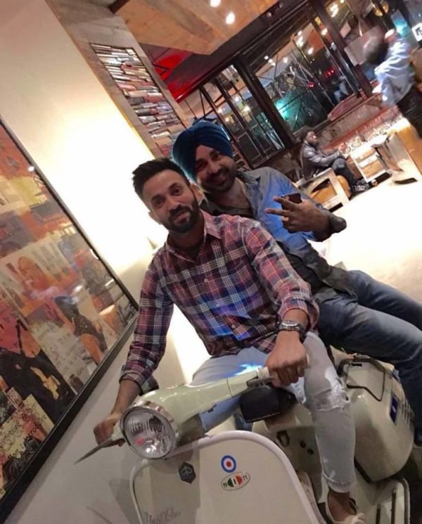 Dilpreet Dhillon Driving Scooter