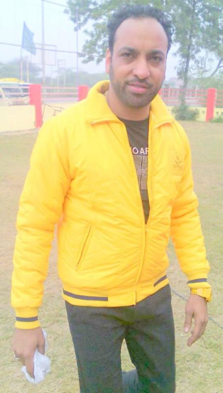 Harjit Harman Wearing Yellow Jacket