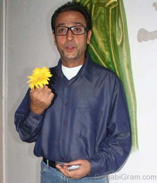 Gulshan Grover Holding Flower